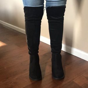 Knee high black suede boots with elastic back